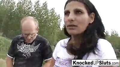 Knocked up slut takes care of a cock outdoors