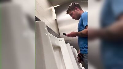 young guy with thick cut dick pissing at urinal - free gay porn