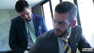 Two nasty businessmen blow the steam off before their meeting 