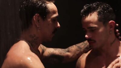 Two tattooed Latinos at the motel Lucas Dias